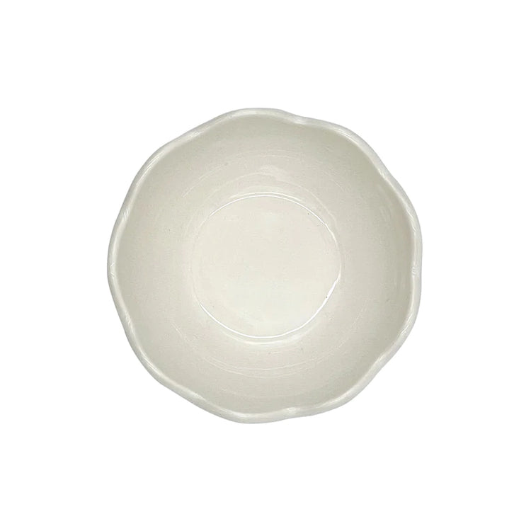 The Voyage Dubai - Small Scalloped Bowl   Handmade in Malta on the grounds of the Baroque Villa Bologna, the scalloped dinnerware collection takes inspiration from the Villa’s architecture to create pleasing silhouettes against any table setting.