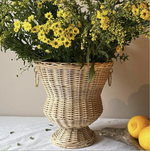 The Voyage Dubai - Handwoven Rattan Medici Vase designed by Mith.cph.  A beautifully crafted piece, made entirely by hand in Indonesia, inspired by the iconic Medici vase.   Use to display plants or flowers or simply as a statement piece in your home.  Origin – Indonesia  Material - Rattan  Approximate Dimensions: 37 cm H x  37 cm Diameter