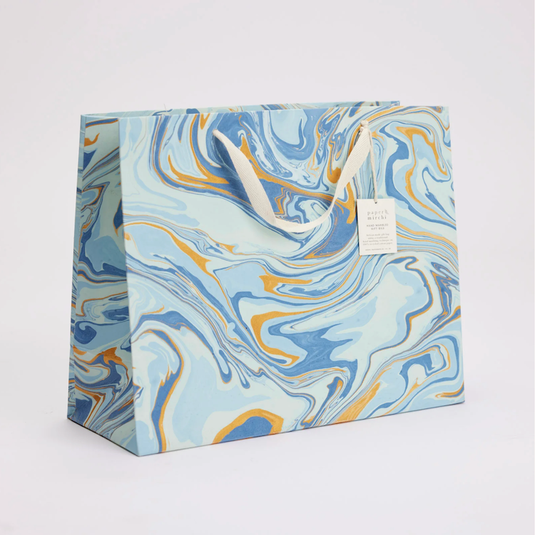 The Voyage Dubai - hand marbled gift bags are made from a strong 250gsm recycled cotton card paper in colours and designs complementing the gift wrap range. The bags are hand marbled by artisans using traditional techniques and are not digitally mass produced.