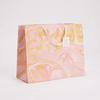 The Voyage Dubai - hand marbled gift bags are made from a strong 250gsm recycled cotton card paper in colours and designs complementing the gift wrap range. The bags are hand marbled by artisans using traditional techniques and are not digitally mass produced.