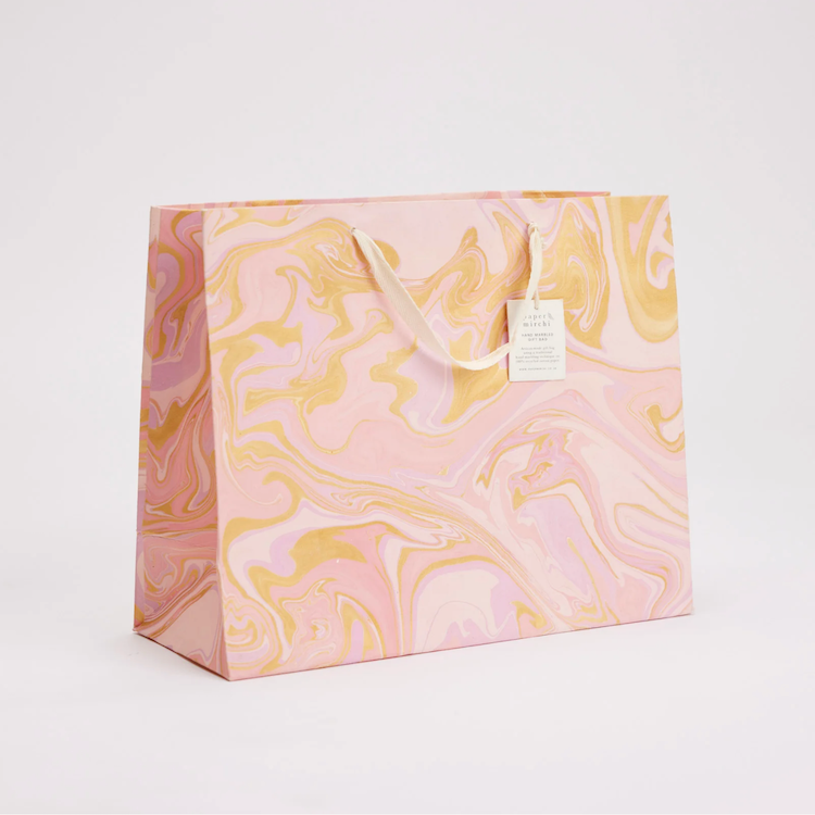 The Voyage Dubai - hand marbled gift bags are made from a strong 250gsm recycled cotton card paper in colours and designs complementing the gift wrap range. The bags are hand marbled by artisans using traditional techniques and are not digitally mass produced.