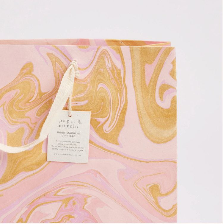 The Voyage Dubai - hand marbled gift bags are made from a strong 250gsm recycled cotton card paper in colours and designs complementing the gift wrap range. The bags are hand marbled by artisans using traditional techniques and are not digitally mass produced.