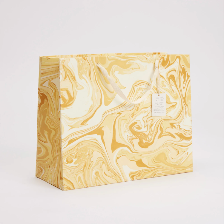 The Voyage Dubai - hand marbled gift bags are made from a strong 250gsm recycled cotton card paper in colours and designs complementing the gift wrap range. The bags are hand marbled by artisans using traditional techniques and are not digitally mass produced.
