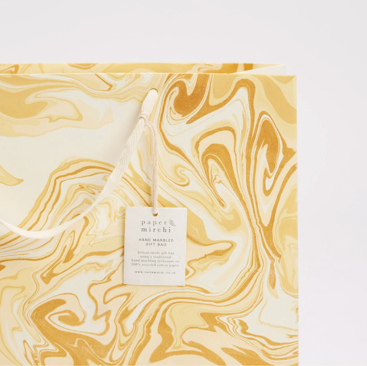 The Voyage Dubai - hand marbled gift bags are made from a strong 250gsm recycled cotton card paper in colours and designs complementing the gift wrap range. The bags are hand marbled by artisans using traditional techniques and are not digitally mass produced.