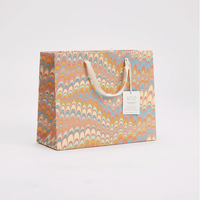The Voyage Dubai - These hand marbled gift bags are made from a strong 250gsm recycled cotton card paper in colours and designs complementing the gift wrap range. The bags are hand marbled by artisans using traditional techniques and are not digitally mass produced.
