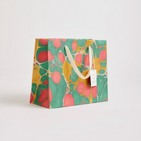 The Voyage Dubai - These hand marbled gift bags are made from a strong 250gsm recycled cotton card paper in colours and designs complementing the gift wrap range. The bags are hand marbled by artisans using traditional techniques and are not digitally mass produced.
