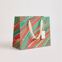 The Voyage Dubai - These hand marbled gift bags are made from a strong 250gsm recycled cotton card paper in colours and designs complementing the gift wrap range. The bags are hand marbled by artisans using traditional techniques and are not digitally mass produced.