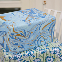 The Voyage Dubai - These paper sheets are each individually hand marbled by skilled artisans on to luxurious cotton handmade papers. They are not screen printed or digitally mass-produced.
The beautiful free-flowing hand marbled designs are suitable for any occasion and are also popular choice for art and craft, origami and bookbinding.