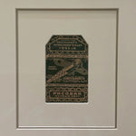 The Voyage Dubai - Vintage 1920s Ottoman Cigarette Rolling Paper.  Framed with neutral mat and classic black and gold frame. Presented behind museum-grade glass to protect the artwork and eliminate reflection.