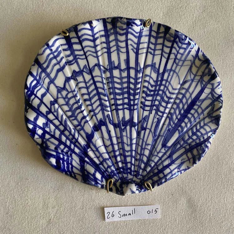Hand-made and decorated ceramic shells from South African artist Lucie de Moyencourt.