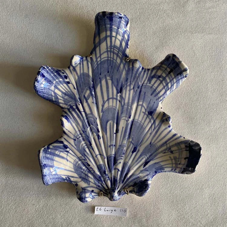 Hand-made and decorated ceramic shells from South African artist Lucie de Moyencourt.