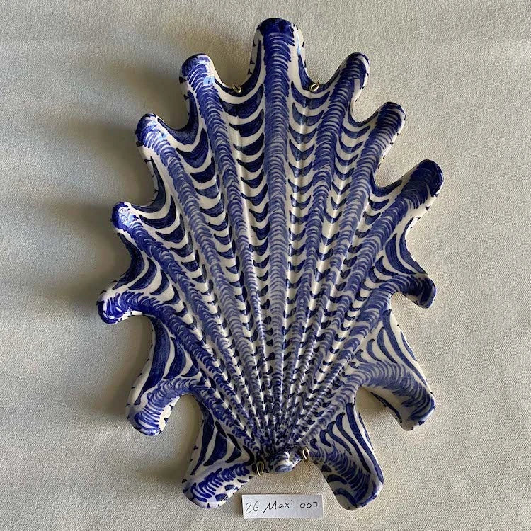 Hand-made and decorated ceramic shells from South African artist Lucie de Moyencourt.