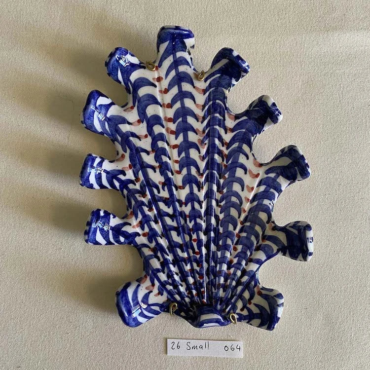 Hand-made and decorated ceramic shells from South African artist Lucie de Moyencourt. 