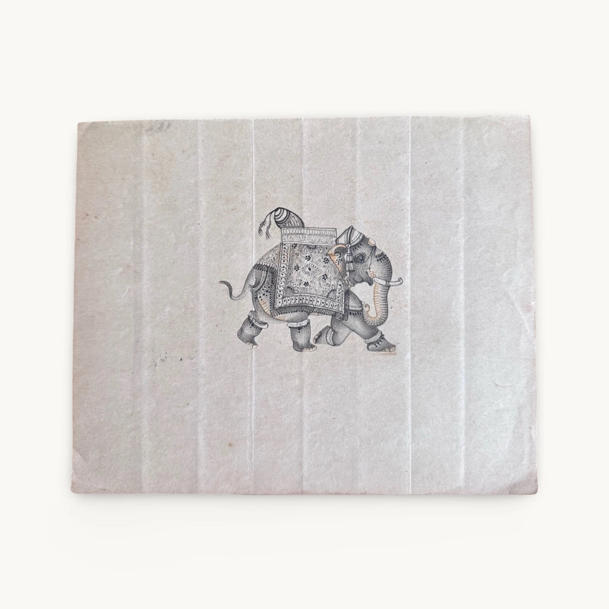 Original miniature painting of a decorated elephant in a patterned blanket and anklets, in dots and fine line on old paper