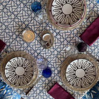 (07) Blue Pagoda tablecloth with the blue lattice running on the diagonal, set for three with rattan chargers and burgundy napkins