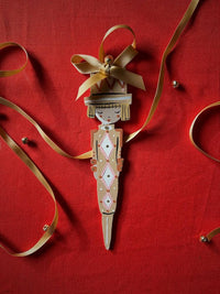 Cracker Girl in Ochre Hand Painted Wooden Ornament by Alice Mary Lynch - The Voyage Dubai