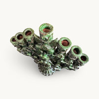 Top view of the green candelabra showing the seven candle cups