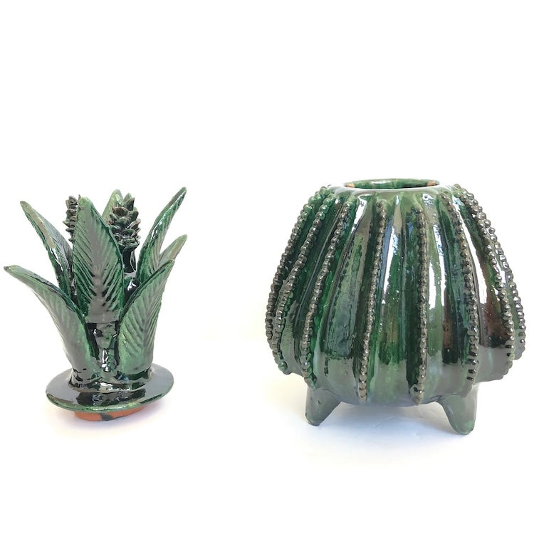 The Voyage Dubai - Piña Michoacána (Glazed Pineapple Urn)  Handcrafted using the 'pastillaje' technique, the striking green glazed terracotta pineapple urn features a striking leaf and cone lid and intricate detailing on the base. Each piece is modeled by hand by talented artists from San Jose de Gracia, Tangancicuaro.