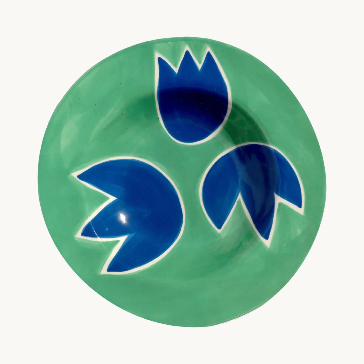 The Voyage Dubai - Blue & Green Tulip Plate - Hand-painted stoneware dinner plate by French designer Laetitia Rouget. Food and dishwasher safe. Made by hand in Portugal. 