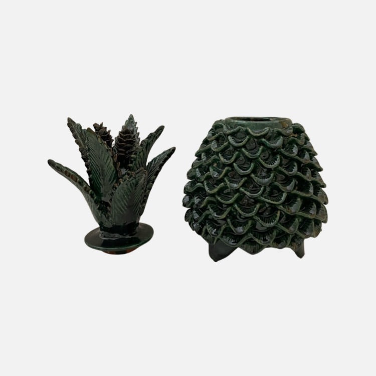 The Voyage Dubai - Piña Michoacána (Glazed Pineapple Urn)  Handcrafted using the 'pastillaje' technique, the striking green glazed terracotta pineapple urn features a striking leaf and cone lid and intricate detailing on the base. Each piece is modeled by hand by talented artists from San Jose de Gracia, Tangancicuaro.