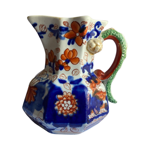 The Voyage Dubai - Antique Mason's Ironstone Imari Jug A rare, antique Mason's Ironstone Hydra Jug with a superb serpent handle in a lovely Imari Pattern. The jug has the octagonal "hydra" shape with a notched snake handle and is decorated in distinctive cobalt blue and floral pattern, which is one of Mason's well known chinoiserie patterns, using bold hand painted enamels of cobalt blue, green and burnt orange all in various shades.