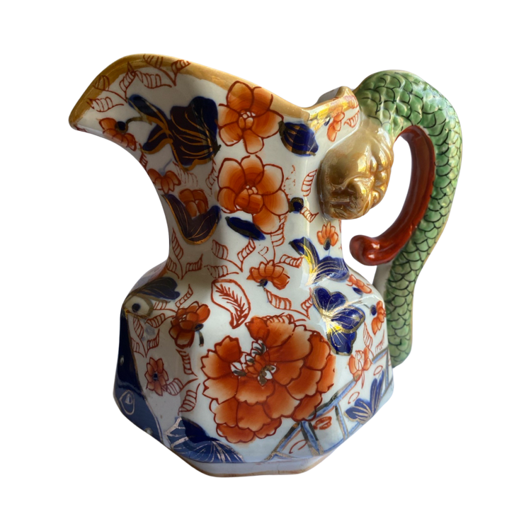 The Voyage Dubai - Antique Mason's Ironstone Imari Jug A rare, antique Mason's Ironstone Hydra Jug with a superb serpent handle in a lovely Imari Pattern. The jug has the octagonal "hydra" shape with a notched snake handle and is decorated in distinctive cobalt blue and floral pattern, which is one of Mason's well known chinoiserie patterns, using bold hand painted enamels of cobalt blue, green and burnt orange all in various shades.