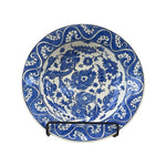 The Voyage Dubai - A set of beautiful hand-painted Iznik ceramic plates from Turkey.  The trio of plates, featuring intricate floral designs in a classic blue and white palette, make a stunning addition to any home.