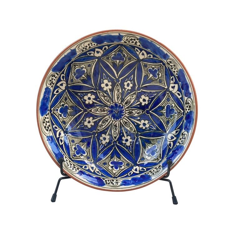 The Voyage Dubai - Hand-painted Iznik ceramic bowl by acclaimed Turkish artist Adil Can Güven. The bowl is painted in a traditional Iznik style with a blue and white floral design.