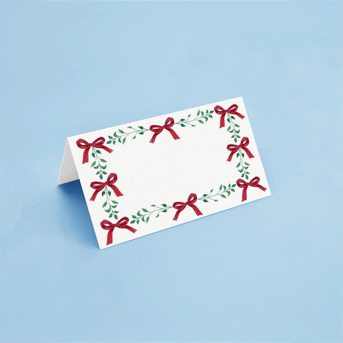 The Voyage Dubai - Christmas Ribbons Place Cards by Aquarela  The perfect finishing touch to the holiday table.  Originally illustrated in watercolour by Portuguese artist India who draws inspiration from her home in Comporta and summers spent in the Bahamas.  Printed on luxury 200gsm textured paper.  Size: 10cm x 8cm   Sold in packs of twelve.