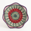 The Voyage Dubai - Fina Basket - Handmade and designed by the women of Mayan Hands El Triunfo cooperative, the Fina basket is a wonderful tabletop accent, delicately handwoven of native grass and pine needles with colorful raffia accents and a scalloped rim.   Handmade and fair trade.  Origin – Guatemala