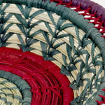 The Voyage Dubai - Fina Basket - Handmade and designed by the women of Mayan Hands El Triunfo cooperative, the Fina basket is a wonderful tabletop accent, delicately handwoven of native grass and pine needles with colorful raffia accents and a scalloped rim.   Handmade and fair trade.  Origin – Guatemala