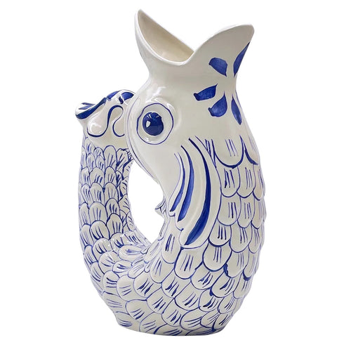 Glug Glug Jug in Navy So called for the delightful gurgling noise the jugs make when poured, they are hand-painted in sunshiney colours and shaped like the leaping fish caught on Maltese fishermen’s boats.
