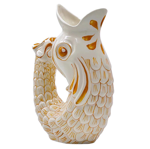 The Voyage Dubai - Glug Glug Jug in Yellow  So called for the delightful gurgling noise the jugs make when poured, they are hand-painted in sunshiney colours and shaped like the leaping fish caught on Maltese fishermen’s boats.  Handmade and hand painted in Malta.