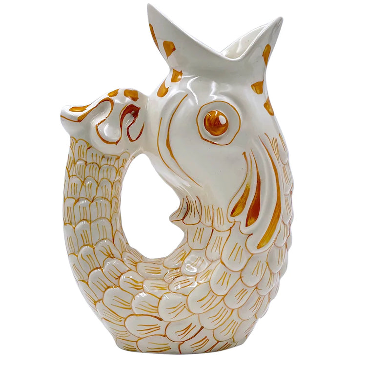 The Voyage Dubai - Glug Glug Jug in Yellow  So called for the delightful gurgling noise the jugs make when poured, they are hand-painted in sunshiney colours and shaped like the leaping fish caught on Maltese fishermen’s boats.  Handmade and hand painted in Malta.