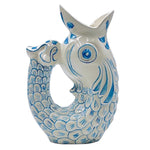 The Voyage Dubai - Glug Glug Jug in Light Blue So called for the delightful gurgling noise the jugs make when poured, they are hand-painted in sunshiney colours and shaped like the leaping fish caught on Maltese fishermen’s boats.  Handmade and hand painted in Malta.