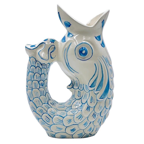 The Voyage Dubai - Glug Glug Jug in Light Blue So called for the delightful gurgling noise the jugs make when poured, they are hand-painted in sunshiney colours and shaped like the leaping fish caught on Maltese fishermen’s boats.  Handmade and hand painted in Malta.