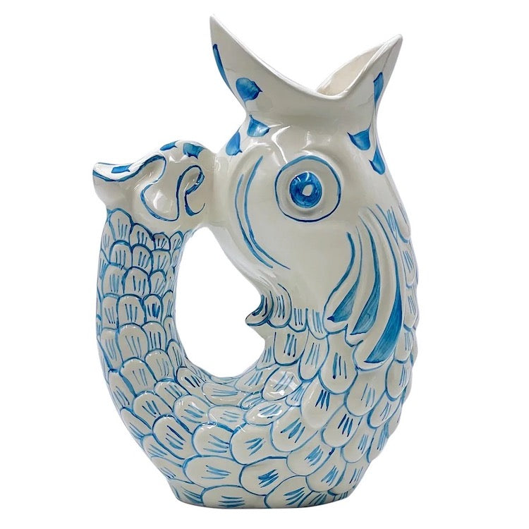 The Voyage Dubai - Glug Glug Jug in Light Blue So called for the delightful gurgling noise the jugs make when poured, they are hand-painted in sunshiney colours and shaped like the leaping fish caught on Maltese fishermen’s boats.  Handmade and hand painted in Malta.