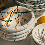 The Voyage Dubai - Splatter Condiment Bowl (Zingla) in Green/Orange A wonderful addition to the tablescape in the distinctive and traditional Mediterranean 'splatter' pattern. Beautiful and versatile, adding charm and character, the zingla bowl is a staple in every Maltese household, traditionally used for myriad domestic purposes. Our bowls are the perfect size for serving nuts, chips and dips.