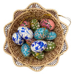The Voyage Dubai - These decorative Easter eggs are handcrafted and painted by skilled artisans in beautiful kashmiri designs.  Made from willow wood and paper mache and individually painted in an assortment of rich, vibrant colours, they come ready with string for hanging and are finished with a gold tassel adding the final touch.  The perfect addition to your Easter tree or table. 