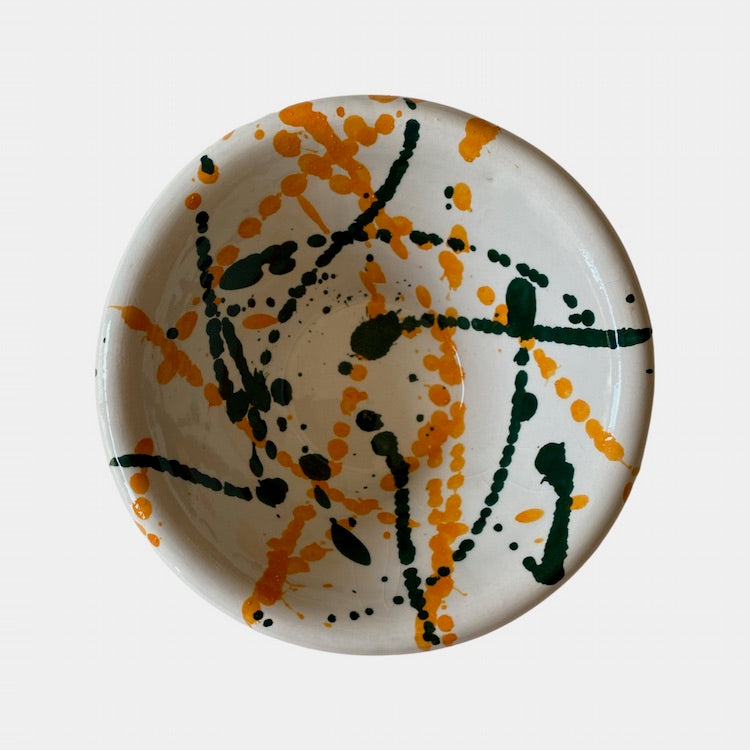 The Voyage Dubai - Splatter Condiment Bowl (Zingla) in Green/Orange  A wonderful addition to the tablescape in the distinctive and traditional Mediterranean 'splatter' pattern.  Beautiful and versatile, adding charm and character, the zingla bowl is a staple in every Maltese household, traditionally used for myriad domestic purposes. Our bowls are the perfect size for serving nuts, chips and dips.