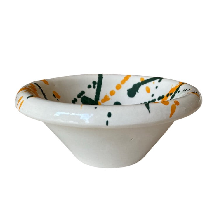 The Voyage Dubai - Splatter Condiment Bowl (Zingla) in Green/Orange  A wonderful addition to the tablescape in the distinctive and traditional Mediterranean 'splatter' pattern.  Beautiful and versatile, adding charm and character, the zingla bowl is a staple in every Maltese household, traditionally used for myriad domestic purposes. Our bowls are the perfect size for serving nuts, chips and dips.