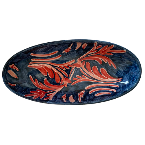 The Voyage Dubai - A wonderful, stylish addition to the table, the large Peacock Oval Serving Plate is sure to add a luxurious feel to any dining table. A standout piece, hand painted with a striking peacock pattern in deep blues and pinks. Perfect for special occasions or everyday use.