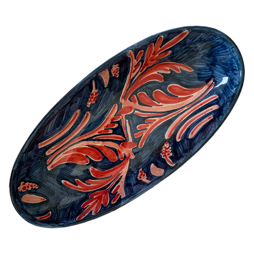 The Voyage Dubai - A wonderful, stylish addition to the table, the large Peacock Oval Serving Plate is sure to add a luxurious feel to any dining table. A standout piece, hand painted with a striking peacock pattern in deep blues and pinks. Perfect for special occasions or everyday use.