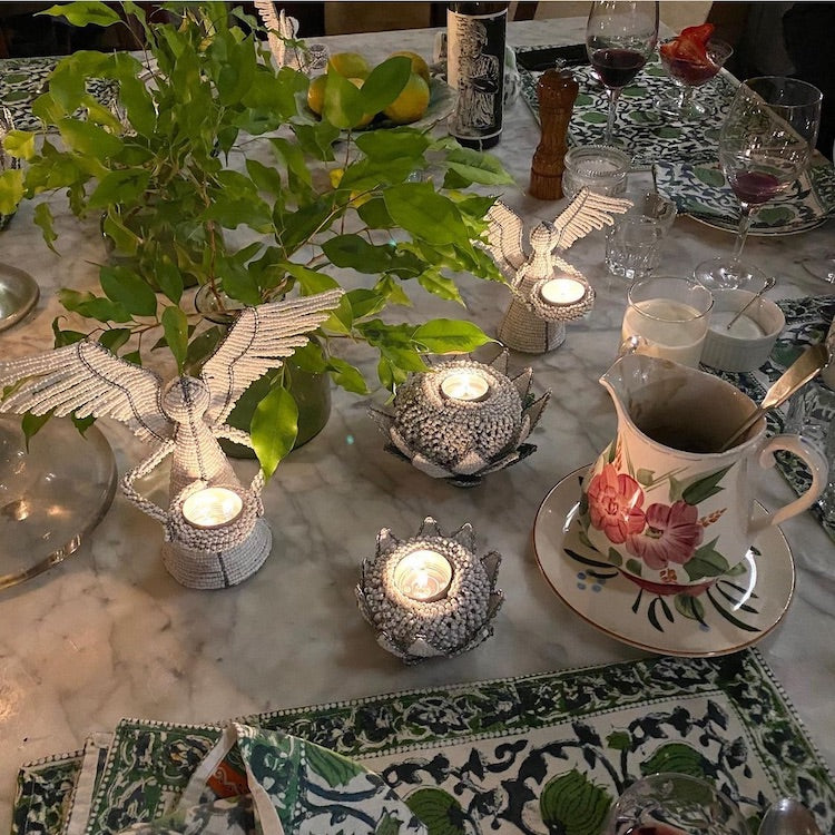 The Voyage Dubai - White Angel Candle Holder.  These charming white angel candle holders add a festive touch to your dining table or mantlepiece. Handmade by Zimbabwean artists 'Bro’s at the Ro', they are stunning on their own or even more lovely when grouped together.