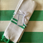 The Voyage Dubai - Made in Tangier Set of 6 Jibli Napkins - Emerald Green Inspired by the Jibli (country) women of Northern Morocco these generously sized table napkins add an element of fun to any table. Available in pure white cotton, as well as fun colourful stripes on a creamy white base, each napkin is finished with matching pom poms. Use as table napkins, tea towels or hand towels.