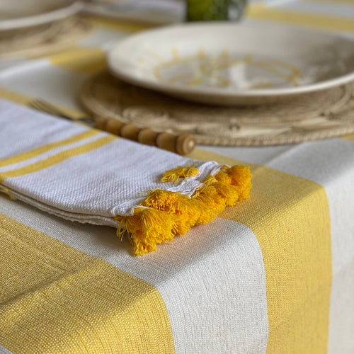 The Voyage Dubai - Lunch in Tangier Thick Stripe Tablecloth - Buttercup Made from a wonderfully soft yet highly durable handwoven cotton, the Lunch in Tangier tablecloth is perfect for everyday use and equally stunning dressed up for a special occasion.