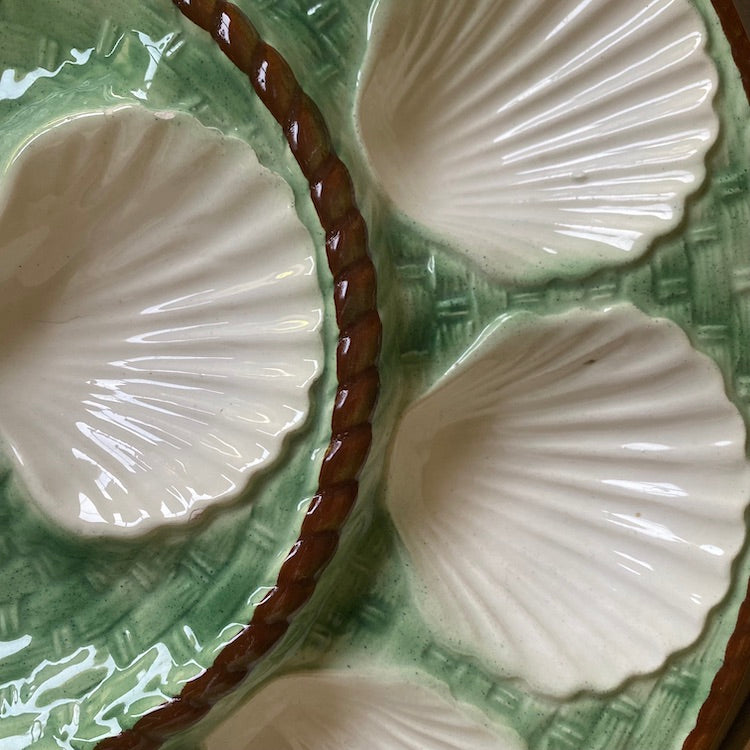The Voyage Dubai - Large vintage French Oyster Serving Plate in the green and white basket weave design.  This is a lovely majolica oyster plate with 12 scalloped oyster compartments, perfect for a party.