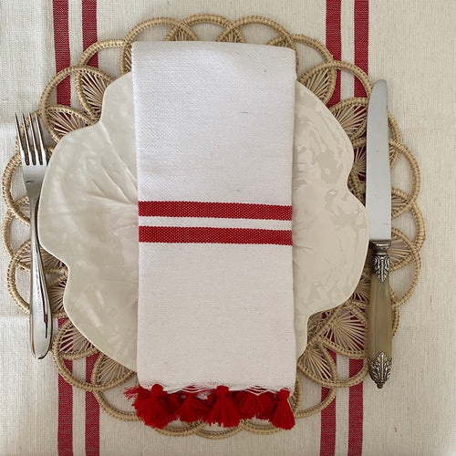 The Voyage Dubai - Made in Tangier Set of 6 Jibli Napkins - Red Stripe  Inspired by the Jibli (country) women of Northern Morocco these generously sized table napkins add an element of fun to any table. Available in pure white cotton, as well as fun colourful stripes on a creamy white base, each napkin is finished with matching pom poms. Use as table napkins, tea towels or hand towels.
