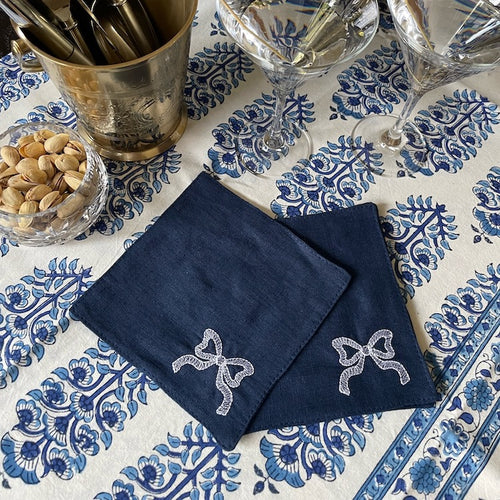 The Voyage Dubai - White Tie Cocktail Napkins in Navy  A classic navy and white pairing with beautifully embroidered bow motifs. Great for any season, perfect for Christmas!  Our cocktail napkins are handcrafted from 100% European linen that has been stonewashed and softened giving them a wonderful, luxurious feel. The cocktail napkins come beautifully presented making for the perfect gift.