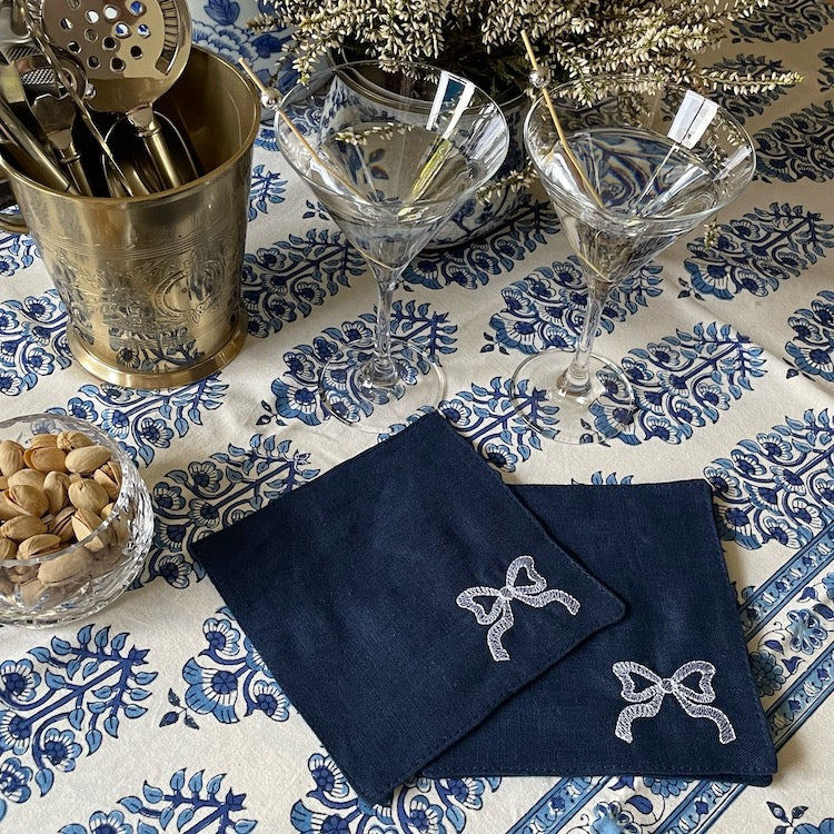 The Voyage Dubai - White Tie Cocktail Napkins in Navy  A classic navy and white pairing with beautifully embroidered bow motifs. Great for any season, perfect for Christmas!  Our cocktail napkins are handcrafted from 100% European linen that has been stonewashed and softened giving them a wonderful, luxurious feel. The cocktail napkins come beautifully presented making for the perfect gift.